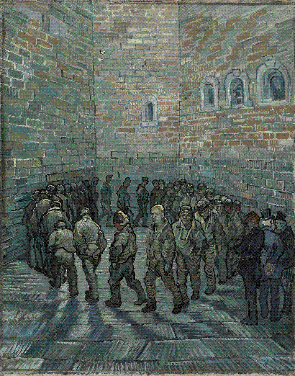 A ring of prisoners in muted uniforms trudging single file in a tight circle at the foot of towering blue-grey prison walls, one man's pale face turned toward the viewer.