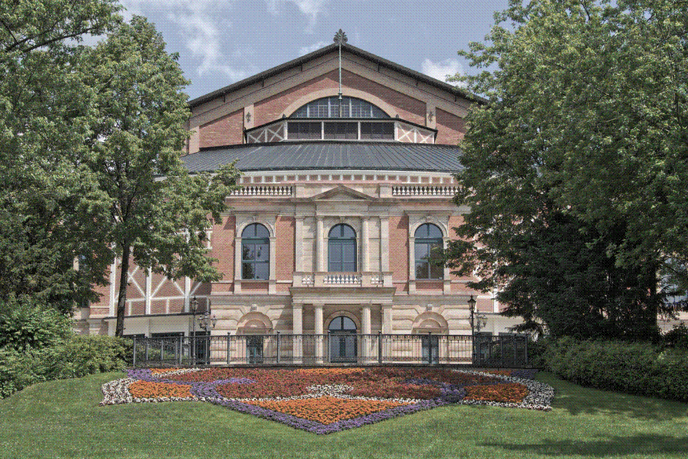 The Bayreuth Festspielhaus, the brick opera house Wagner built for the Ring, seen across its forecourt.
