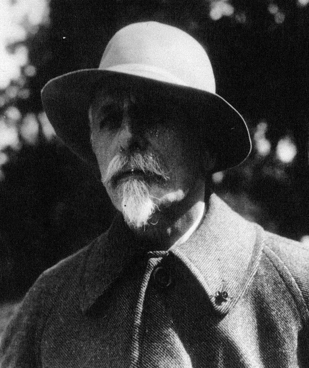 Formal press photograph of Sir Basil Zaharoff, the Vickers arms salesman known as the "merchant of death," an elderly bearded man in a dark overcoat and top hat.