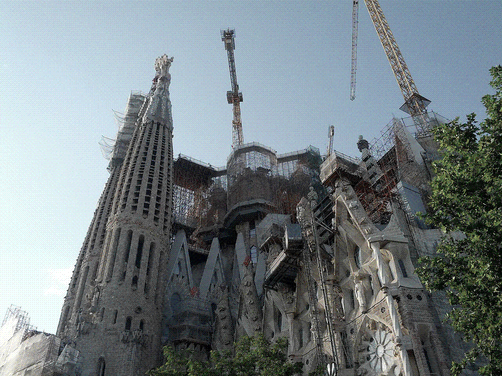 The spires of the Sagrada Família in Barcelona surrounded by construction cranes, still unfinished in 2015.