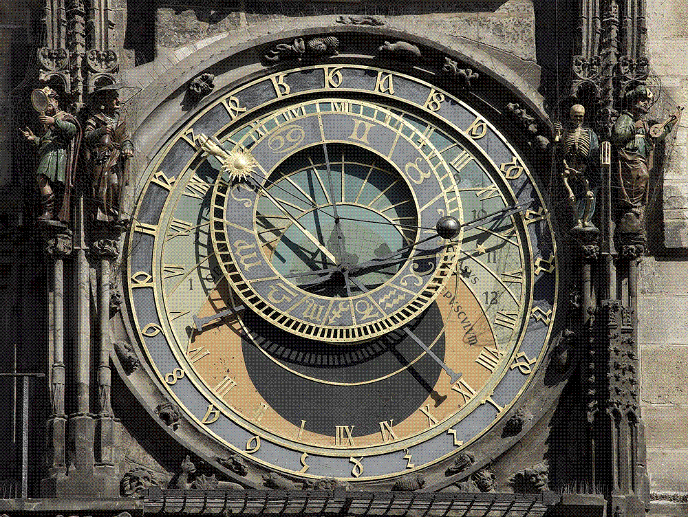 The blue-and-gold astronomical dial of the Prague Orloj, showing the positions of the sun and moon over the city.