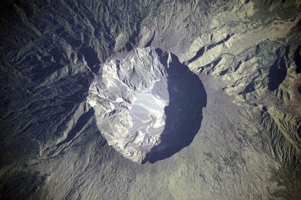 Astronaut photograph of the six-kilometre-wide summit caldera of Mount Tambora, Sumbawa, Indonesia, left behind when the mountain's peak was blown away in the eruption of April 1815 (NASA Earth Observatory).