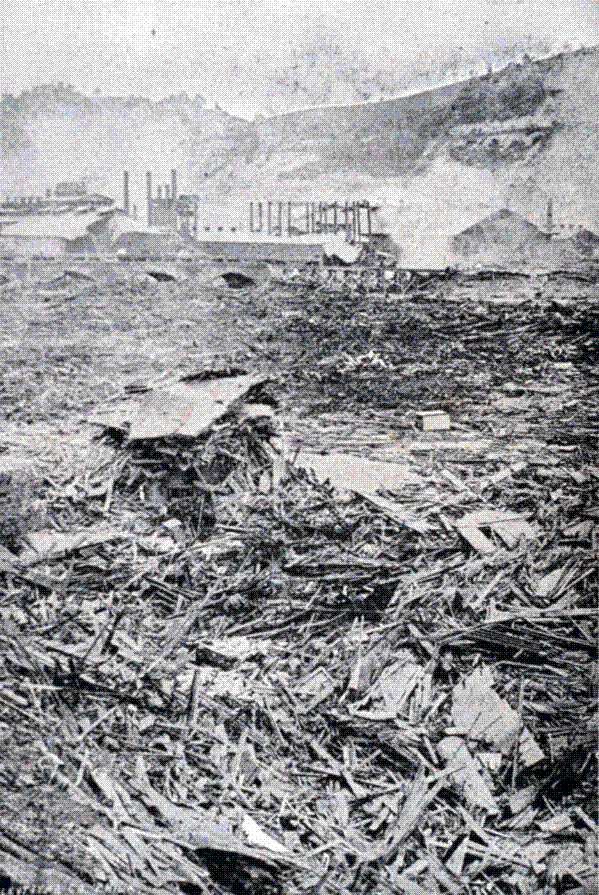 Photograph of the mountain of wreckage above the Pennsylvania Railroad bridge at Johnstown after the flood of 31 May 1889, from which bodies were recovered for months