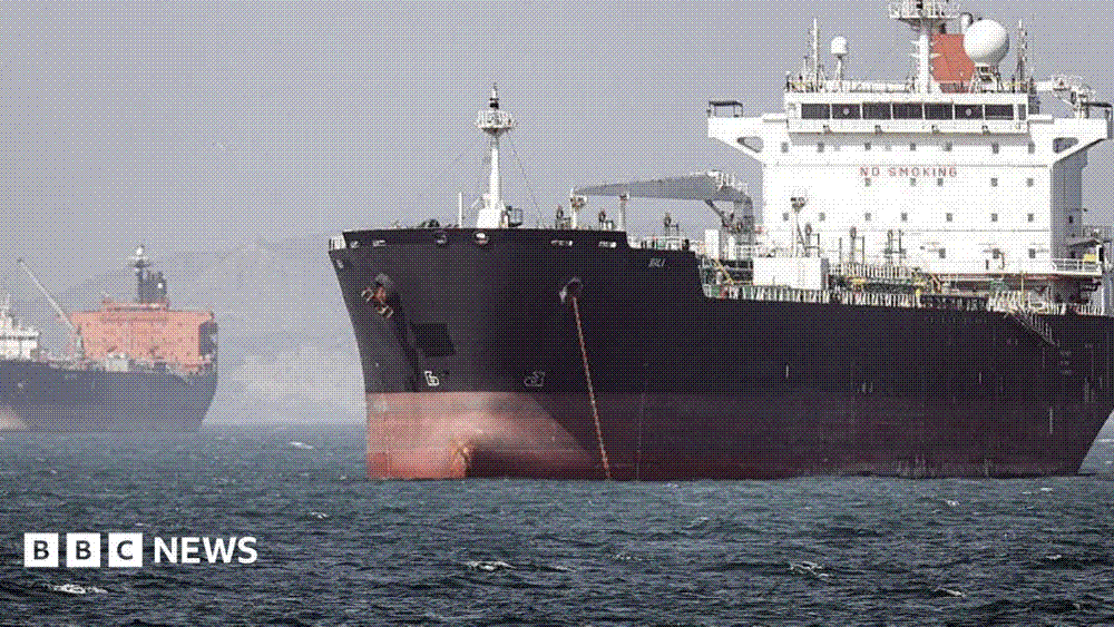 Tankers riding at anchor in hazy light in the Strait of Hormuz off Bandar Abbas in southern Iran.