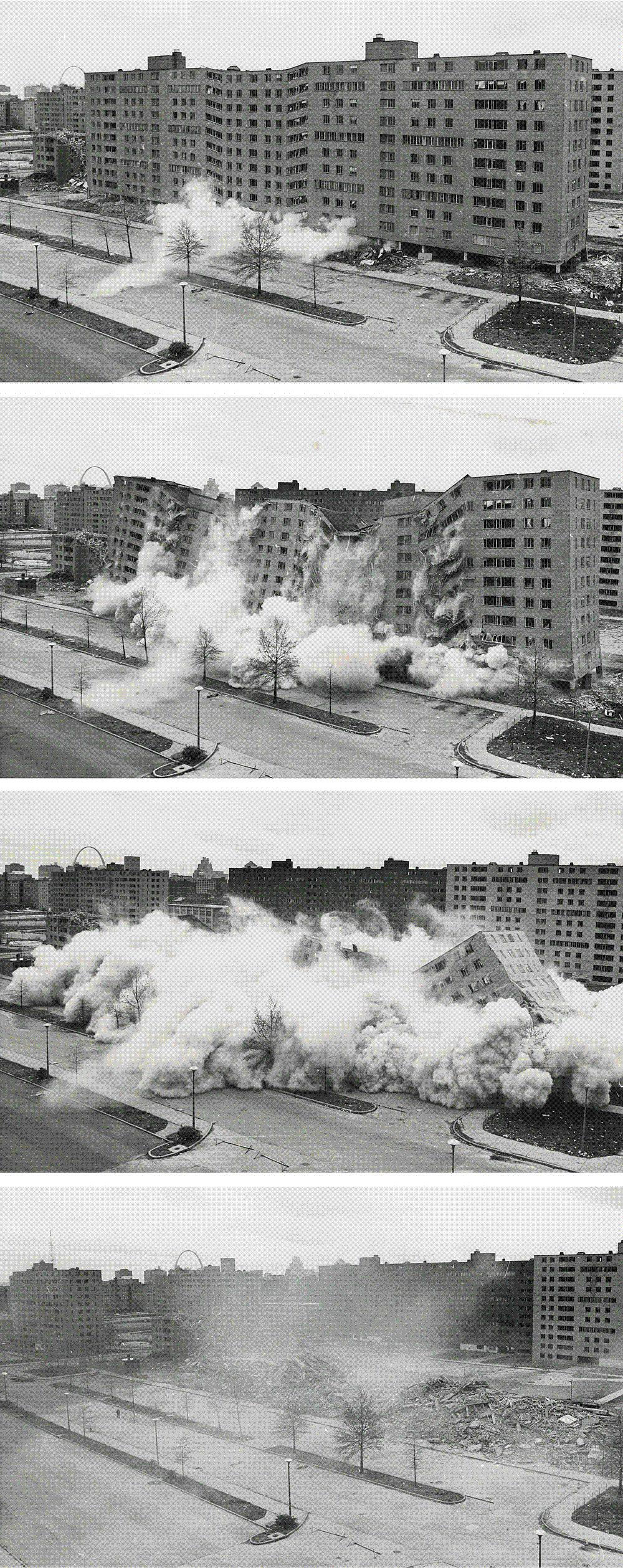 A Pruitt-Igoe housing block mid-collapse during its televised demolition in April 1972, dust erupting as the tower folds