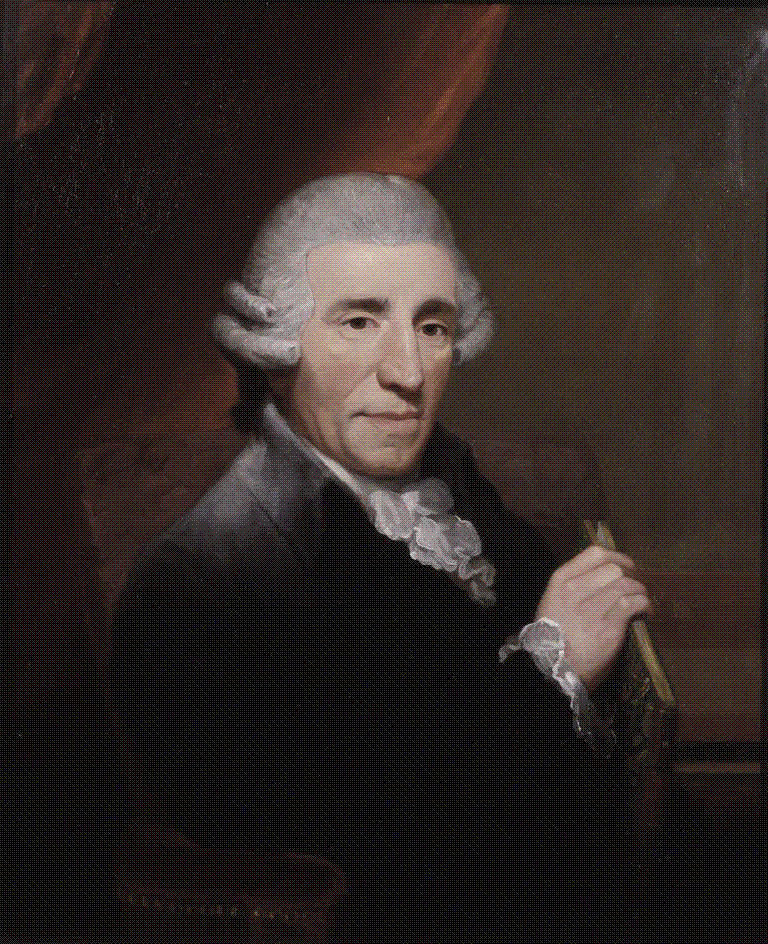 Half-length painted portrait of composer Joseph Haydn in a grey coat and powdered wig, seated and facing right, holding a bound volume with a keyboard instrument behind him.