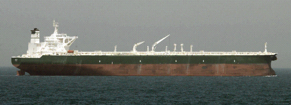 A laden crude-oil supertanker, the AbQaiq, riding low and alone across open sea.