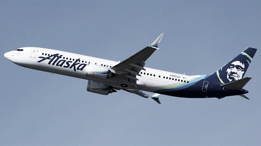 A new twin-engine Boeing 737 MAX airliner in flight against a clear sky.