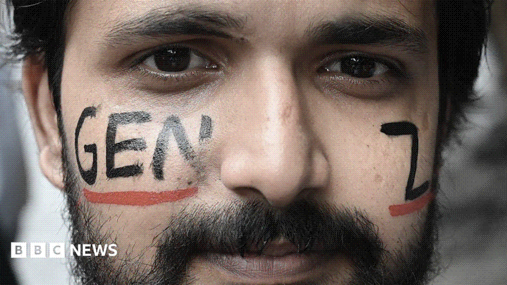 A young man with the words Gen-Z painted on his face at a Cockroach Janta Party protest at Jantar Mantar in New Delhi.